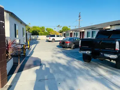a truck parked in a parking lot next to a building at Cozy motel in Lynwood