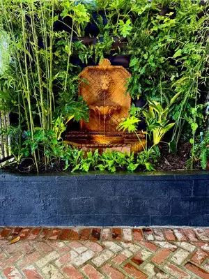 a water fountain in the middle of a garden at HOLLYWOOD HILLS JETLINER VIEWS at STUDIO 1080 HOLLYWOOD in Los Angeles