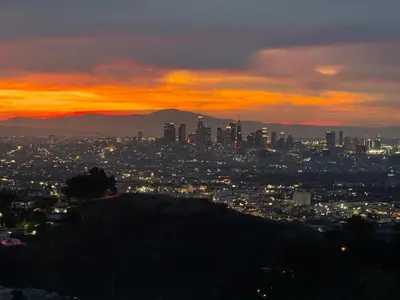 a view of a city at sunset at HOLLYWOOD HILLS JETLINER VIEWS at STUDIO 1080 HOLLYWOOD in Los Angeles