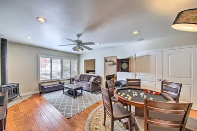 a living room with a pool table and a couch at Mountain Gem with Game Room, 5 Mi to Lake Arrowhead! in Lake Arrowhead
