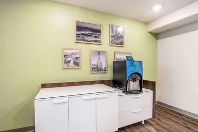 a room with a coffee machine on a counter at WoodSpring Suites Colton in Colton