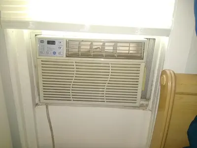 a air conditioner in a wall in a room at Home Sweet Home in Colton