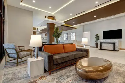 a living room with a couch and a table at Hilton Garden Inn Anaheim Resort in Anaheim