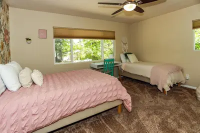 a bedroom with two beds and a window at Bohemia Big Bear-1926 by Big Bear Vacations in Big Bear Lake