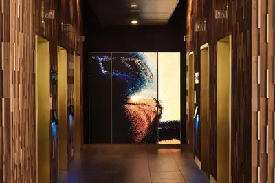 a hallway with a large painting on the wall at Hyatt Place LAX/Century BLVD in Los Angeles