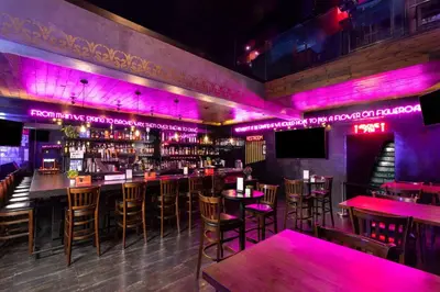 a bar with pink lighting in a restaurant at The Haas, Trademark Collection by Wyndham in Los Angeles
