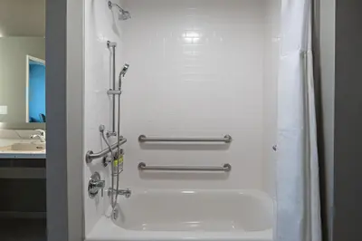 a bathroom with a shower with a bath tub at Staybridge Suites - Long Beach Airport by IHG in Long Beach