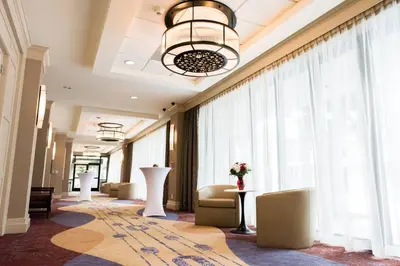 a lobby with a waiting room with a large window at Staybridge Suites - Long Beach Airport by IHG in Long Beach