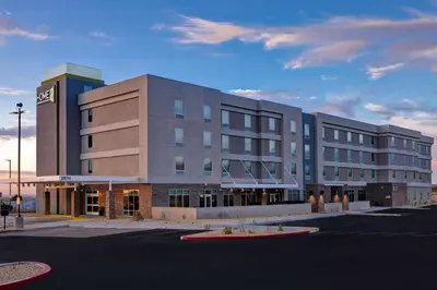 a large building in front of a parking lot at Home2 Suites By Hilton Barstow, Ca in Barstow