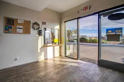an empty room with an open door to a store at High Desert Inn in Hesperia
