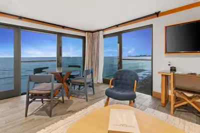 a living room with a view of the ocean at SA Carbon Beach Suites in Malibu