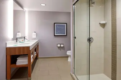 a bathroom with a shower and a sink and a toilet at Hyatt Place Los Angeles / LAX / El Segundo in El Segundo