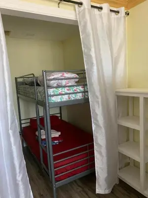a room with two bunk beds in a room at LAX guest house in Inglewood