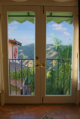 a glass door with a view of a mountain view at Topanga Canyon Inn Bed and Breakfast in Topanga