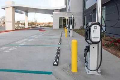 a row of parking meters in front of a building at Fairfield by Marriott Inn & Suites Anaheim Los Alamitos in Los Alamitos