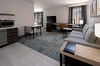 a living room with a couch and a table at Residence Inn by Marriott Valencia in Valencia