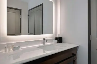 a bathroom with a white sink and a mirror at Homewood Suites By Hilton Santa Clarita/Valencia, Ca in Santa Clarita