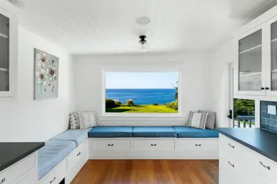 a kitchen with a window seat with a view of the ocean at 50 PCT OFF! Malibu Ocean Escape, Pool, Walk to Beach in Malibu