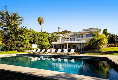 a swimming pool in front of a house at 50 PCT OFF! Malibu Ocean Escape, Pool, Walk to Beach in Malibu