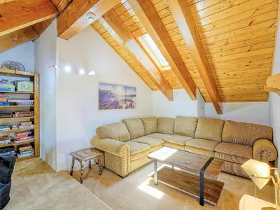 a living room with a couch and a table at Kid's Paradise! Ball Pit 2 Lofts Lakeview 5 bd, 3ba in Lake Arrowhead