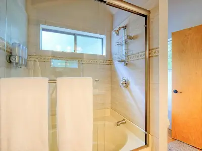 a bathroom with a shower with a glass door at Kid's Paradise! Ball Pit 2 Lofts Lakeview 5 bd, 3ba in Lake Arrowhead