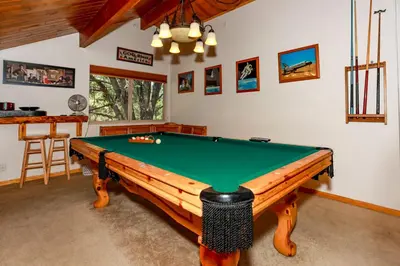 a room with a pool table in a room at Mountain Adventure - 1931 by Big Bear Vacations in Big Bear Lake