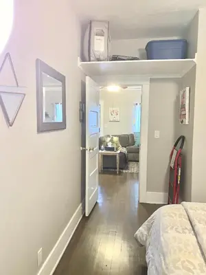 a bedroom with a bed and a living room with a couch at Private 1BR Apt LA Home Sweet Home in KTown\u5bb6 in Los Angeles