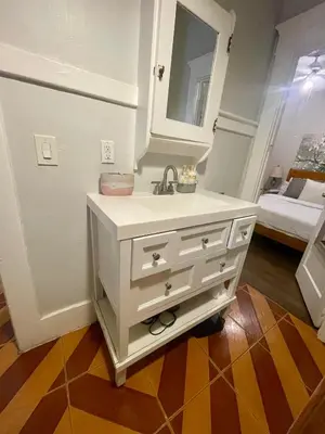 a bathroom with a white sink and a mirror at Private 1BR Apt LA Home Sweet Home in KTown\u5bb6 in Los Angeles