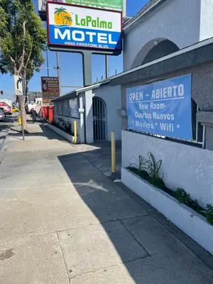 a sign for a motel on the side of a building at La Palma Motel, South Gate - Los Angeles area in South Gate