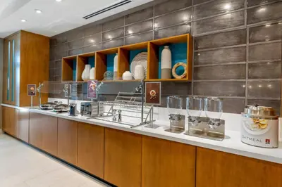 a kitchen with a counter with glasses on it at SpringHill Suites by Marriott Anaheim Placentia Fullerton in Placentia