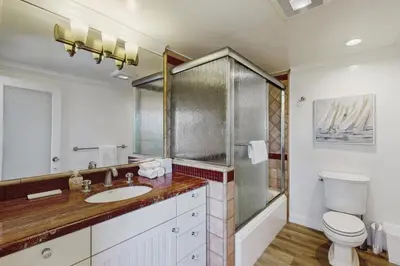 a bathroom with a sink and a toilet at Savor the View in Oxnard