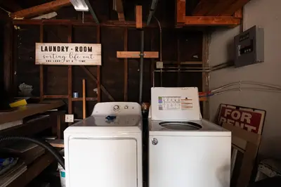 a laundry room with a stove and a refrigerator at Heartwell Park Beauty Long Beach in Long Beach