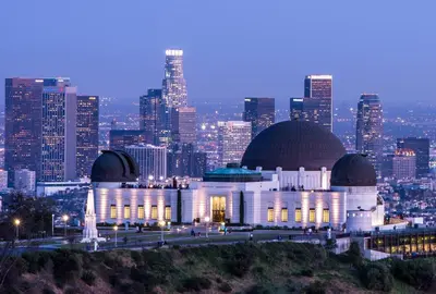 a building with a city skyline in the background at The California - Hollywood in Los Angeles