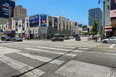 an empty city street with cars driving on the road at Hotel H-Wood in Los Angeles
