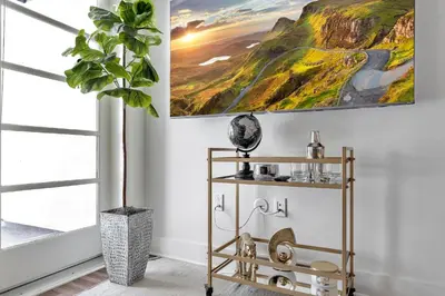 a living room with a painting on the wall at 4 SantaMonica De Lux in Los Angeles