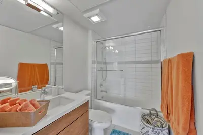 a bathroom with a shower and a toilet and a sink at 3 Lux large apartment heart of SM in Los Angeles