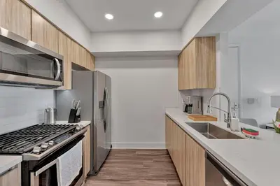 a kitchen with a stove and a sink at 3 Lux large apartment heart of SM in Los Angeles
