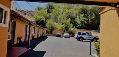 a street with cars parked on the side of a building at DAY N NIGHT INN - Near Universal Studios Hollywood in Los Angeles