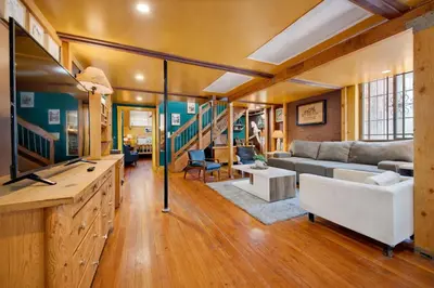 a living room with a couch and a table at St. Vincent Lofts in Los Angeles