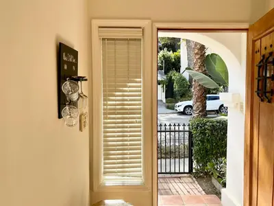 a door to a house with a window with a shutter at Hollywood Hills Homestay in Los Angeles