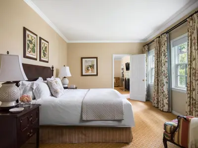 a bedroom with a large bed and a window at The Langham Huntington, Pasadena in Pasadena