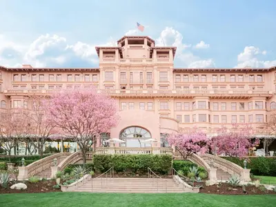 a large pink building with stairs in front at The Langham Huntington, Pasadena in Pasadena