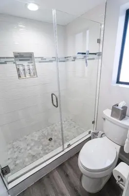 a bathroom with a shower and a toilet at 50 M to Sand LGB 2 King Suites in Long Beach