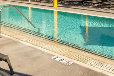 a swimming pool with a no entry sign next to it at Apart Hotel near Dodgers Stadium in Los Angeles