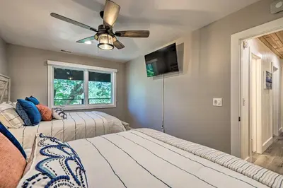 a bedroom with two beds and a ceiling fan at Airy Alpine Getaway with Lake Arrowhead Views! in Lake Arrowhead