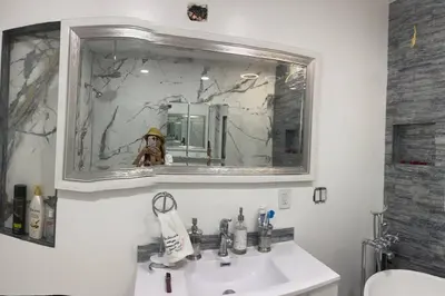a bathroom with a sink and a mirror at Blanquitas Home in Long Beach