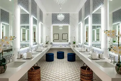 a bathroom with two sinks and two mirrors at Westlake Village Inn in Westlake Village