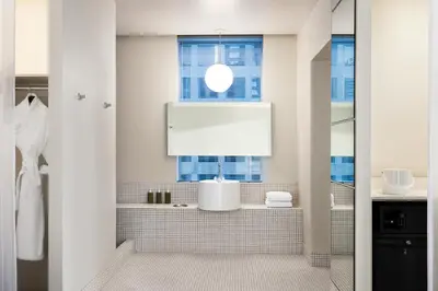 a bathroom with a sink and a window at The Delphi Downtown LA in Los Angeles