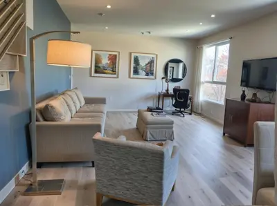 a living room with a couch and a tv at Hollywood Homes Free parking close to all things LA in Los Angeles