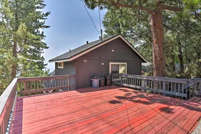 a large wooden deck with a small shed at A-Frame Cali Cabin with Unobstructed Valley Views! in Running Springs